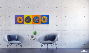 Painting of 4 super bright happy donuts, each decorated with frosting and sparkles in an office setting